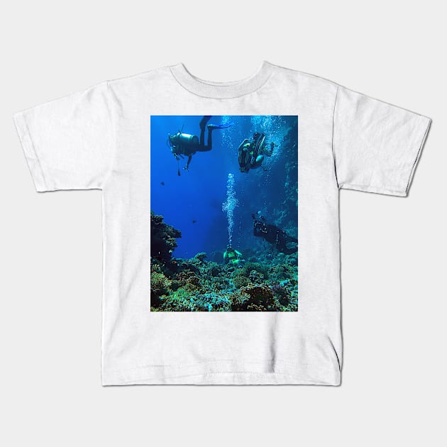 Coral reef and scuba divers Kids T-Shirt by likbatonboot